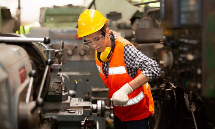 female-engineers-operating-a-cnc-machine-in-factor