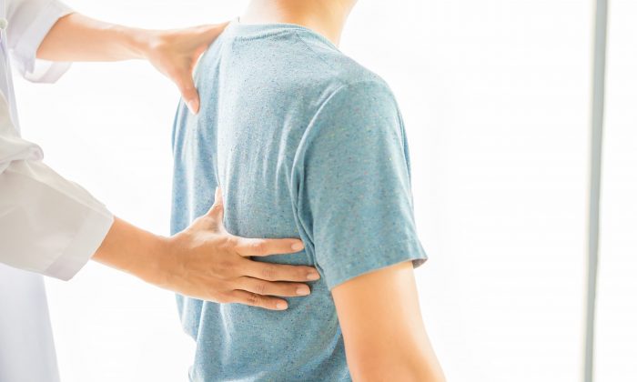 Close up of Physiotherapist working with patient in clinic